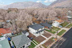 Aerial view of residential area featuring a mountain backdrop