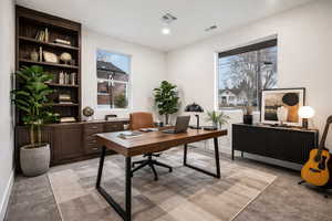 Office featuring radiator, light carpet, and recessed lighting