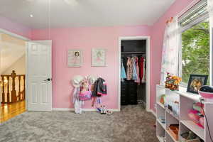 Bedroom featuring carpet floors and a ceiling fan
