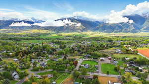 Aerial perspective of suburban area featuring a mountain backdrop