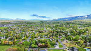 Aerial perspective of suburban area with a mountain backdrop