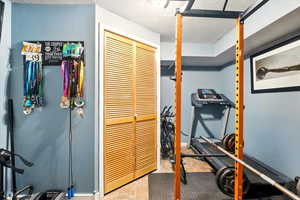 Workout area with a textured ceiling
