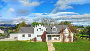 View of front of house featuring a porch and roof with shingles