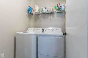 Laundry room featuring washer and clothes dryer
