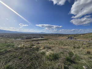 View of mountain background featuring rural landscape