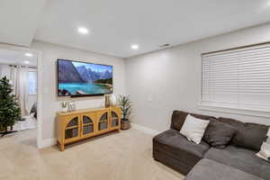 Living room featuring carpet flooring and recessed lighting