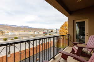 Balcony featuring a mountain view and a residential view