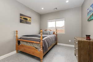 Bedroom featuring baseboards and recessed lighting