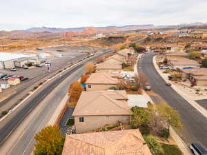 Aerial view of residential area featuring a mountainous background