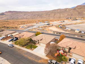Aerial perspective of suburban area featuring a mountainous background