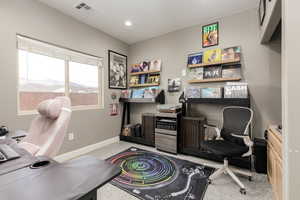 Office area with baseboards and recessed lighting