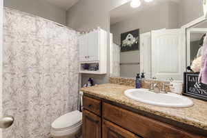 Bathroom featuring vanity and a shower with curtain