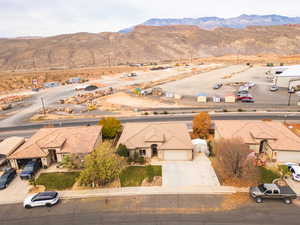 Aerial perspective of suburban area featuring a mountainous background