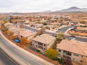 Aerial perspective of suburban area featuring a mountain backdrop