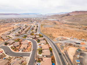 View of property location with mountains and nearby suburban area