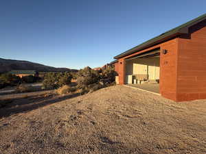 View of yard featuring a mountain view and a patio area