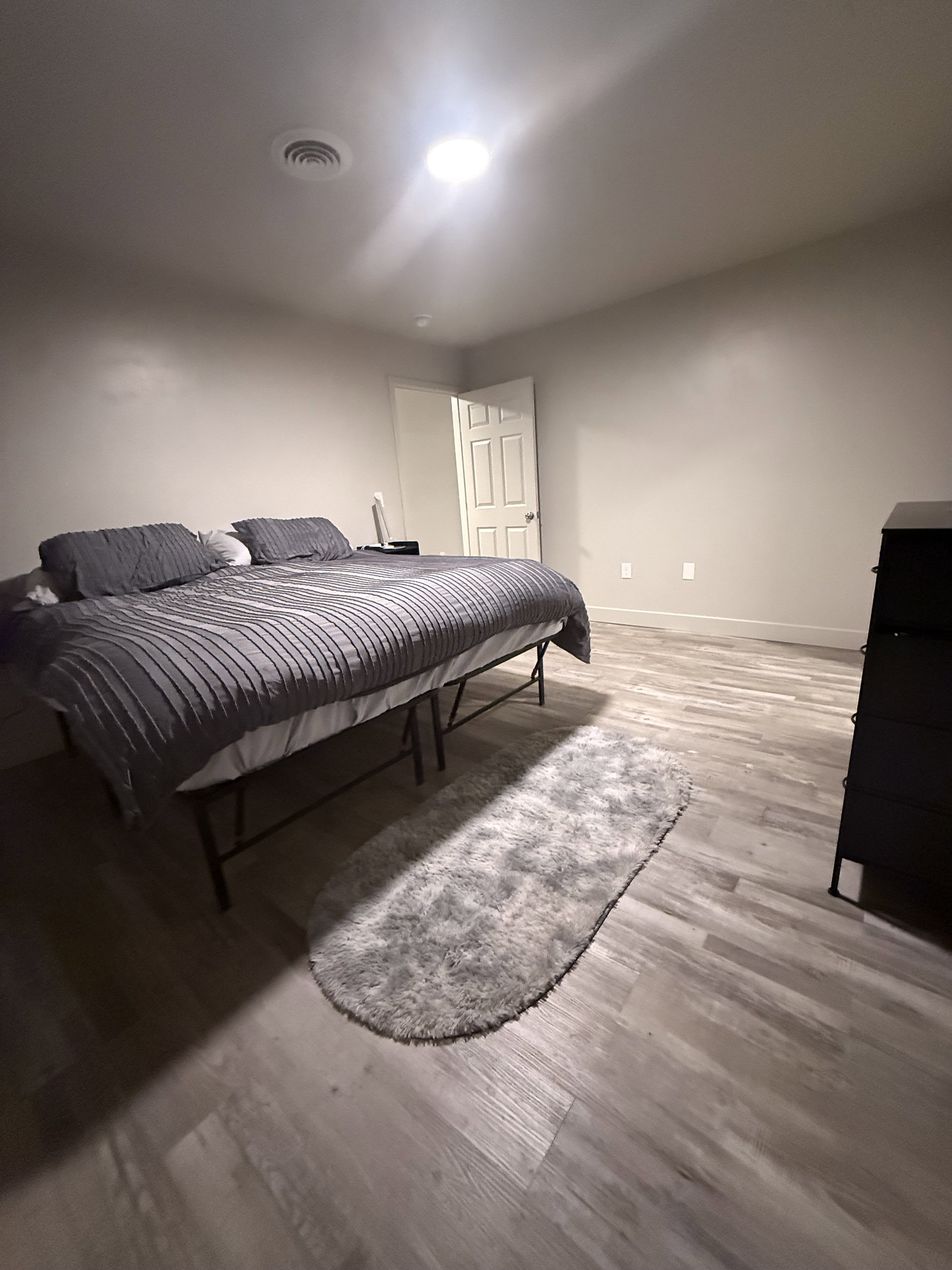 Bedroom featuring light wood-style floors and baseboards