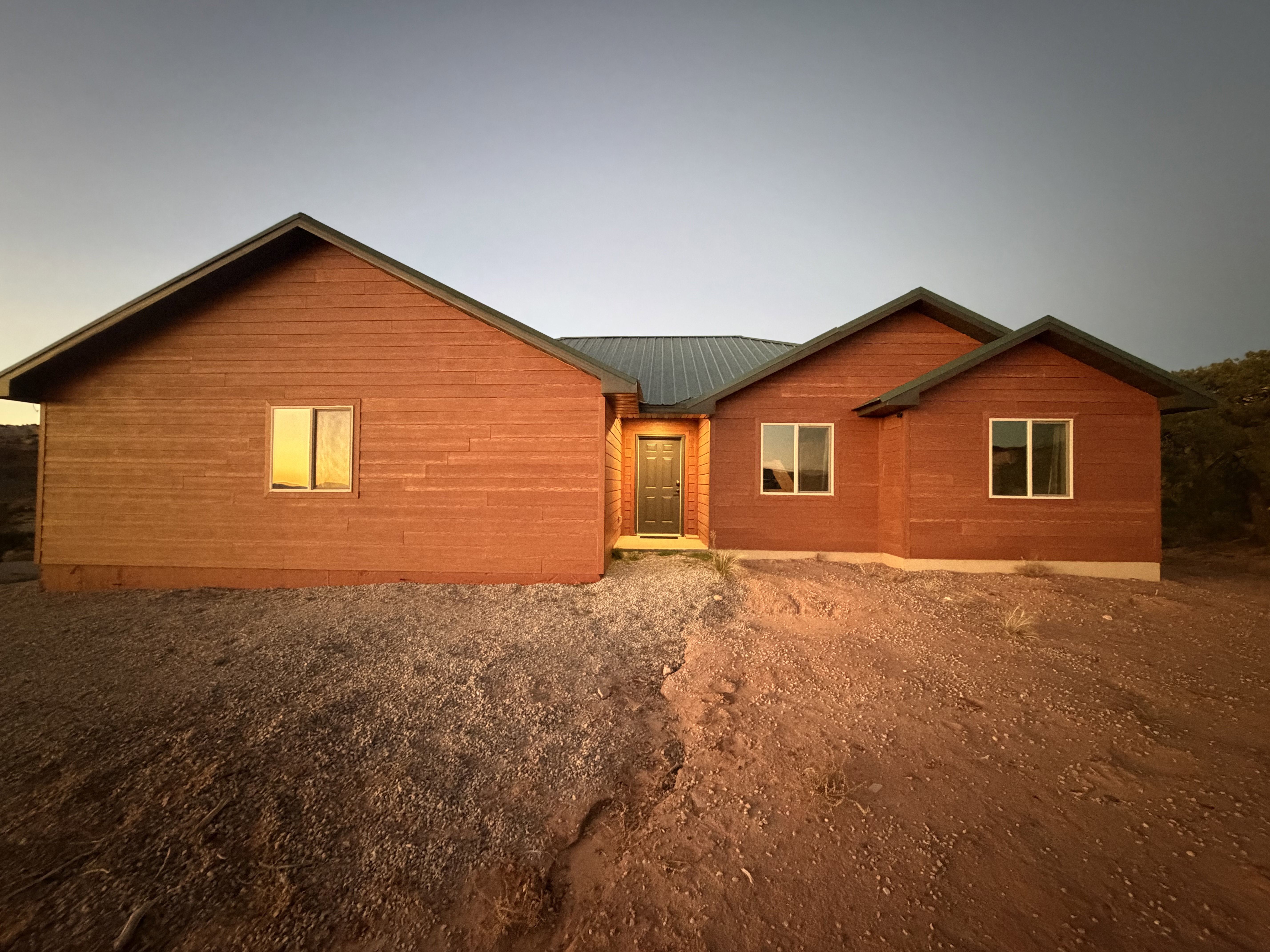 Rear view of house featuring a metal roof