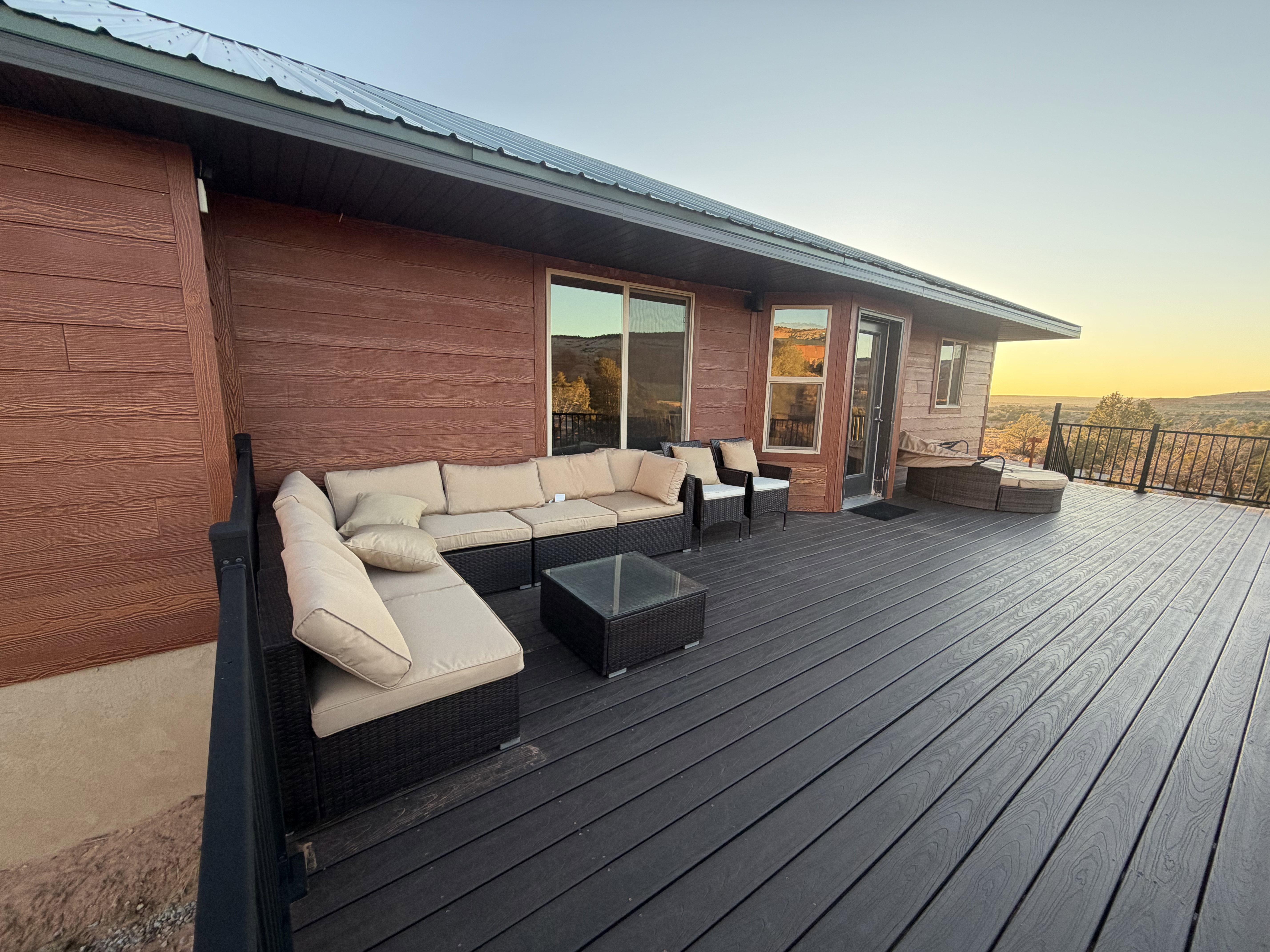 Deck at dusk with an outdoor hangout area
