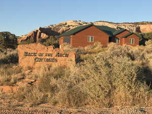 Exterior space featuring a garage, a mountain view, and a metal roof