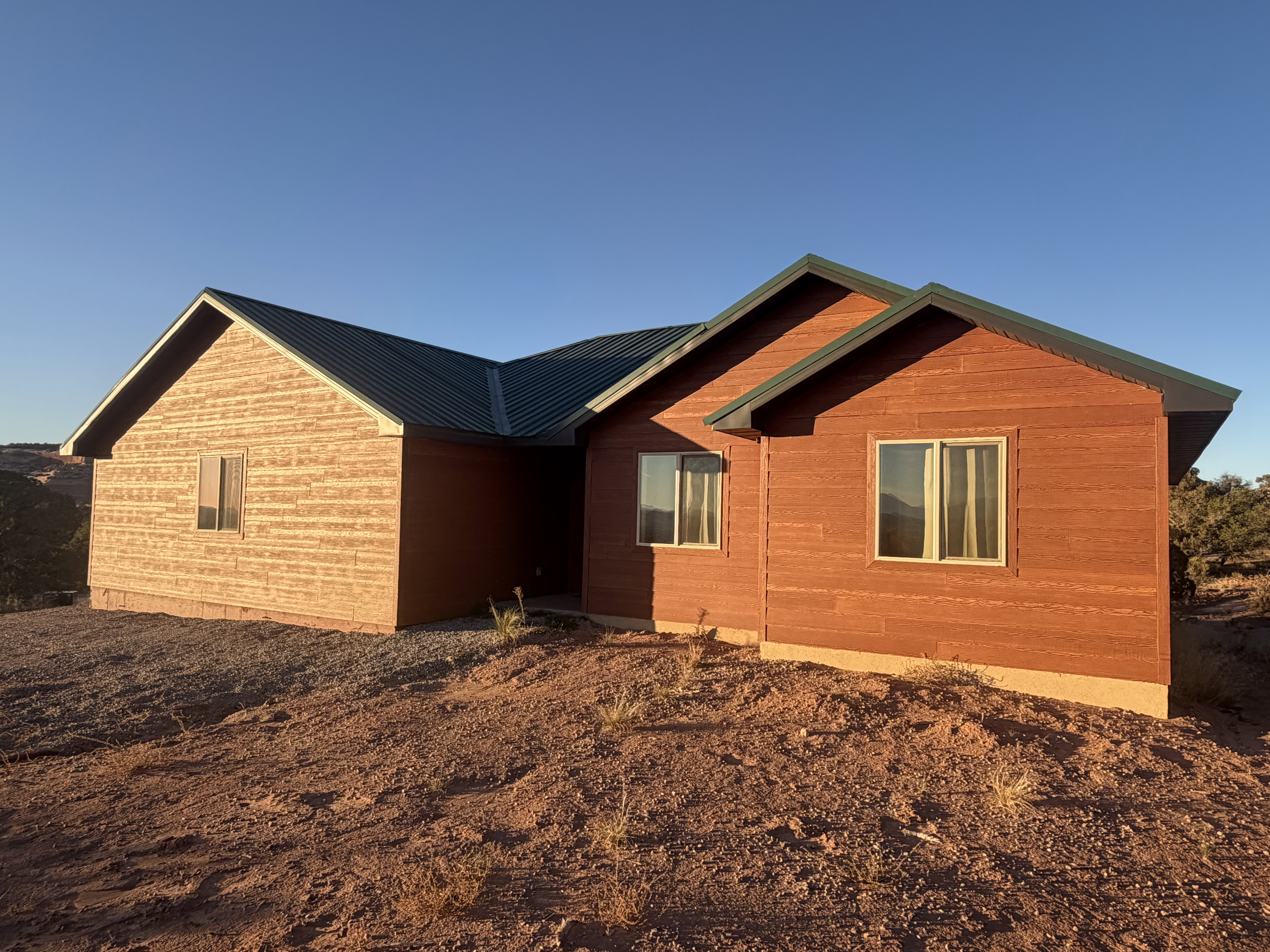 View of side of property featuring a metal roof