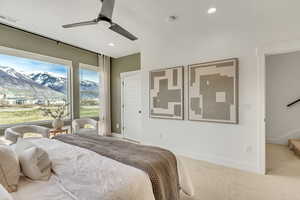 Bedroom with a mountain view, carpet, a ceiling fan, and recessed lighting