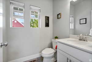 Bathroom with vanity and dark wood finished floors
