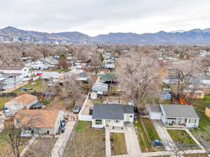 Aerial perspective of suburban area featuring a mountainous background