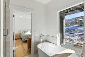 Ensuite bathroom with a freestanding tub