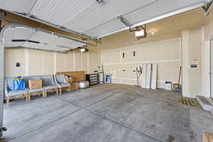 Garage featuring a garage door opener