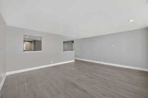 Unfurnished room featuring recessed lighting and wood finished floors