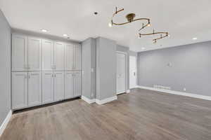 Unfurnished dining area with recessed lighting and light wood-style flooring