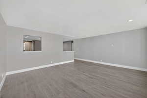 Unfurnished room with recessed lighting and light wood-style floors