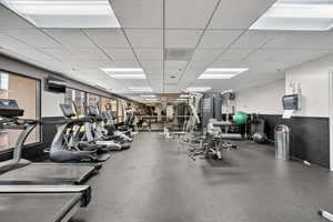 Gym featuring a paneled ceiling