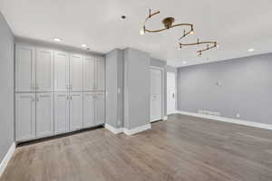 Interior space with recessed lighting, light wood finished floors, and a closet