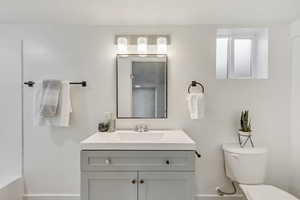 Bathroom with vanity and toilet