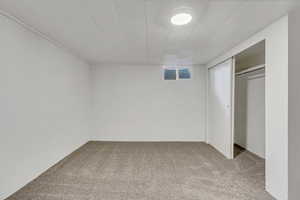 Unfurnished bedroom featuring carpet floors and a closet