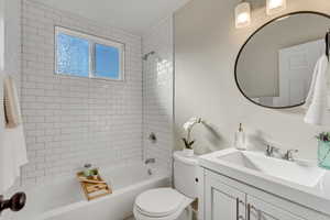 Bathroom with vanity and  shower combination
