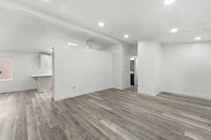 Basement featuring light wood finished floors and recessed lighting