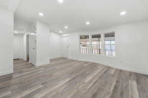 Empty room featuring recessed lighting and light wood finished floors