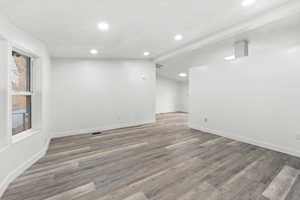 Spare room featuring light wood-style floors and recessed lighting