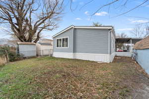 View of property exterior with a sunroom