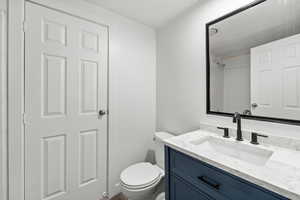 Bathroom with vanity and a shower