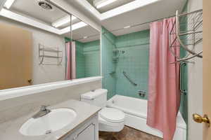 Full bathroom featuring vanity and shower / bath combination with curtain