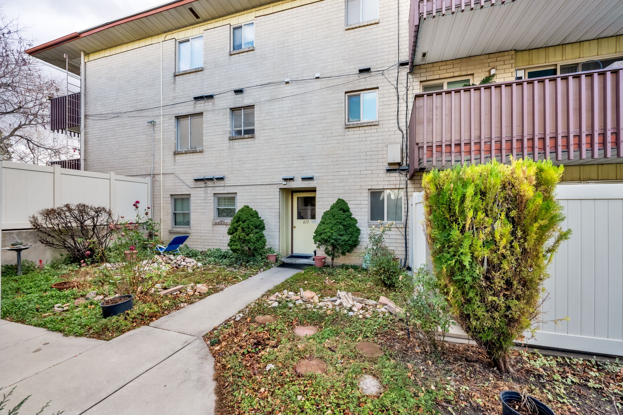 Doorway to property featuring brick siding