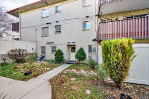 Doorway to property featuring brick siding