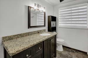 Bathroom featuring vanity and a shower