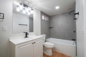 Full bath featuring vanity,  shower combination, and light wood-style flooring
