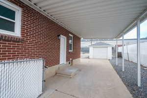 View of patio / terrace featuring an outdoor structure