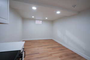Interior space with light wood-style flooring and recessed lighting